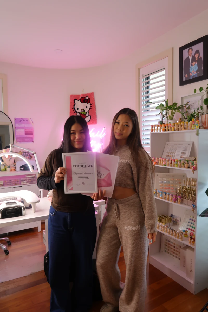 Chelsea and a course graduate celebrating with a certificate